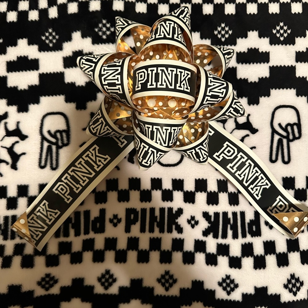 4 Victoria secret pink display bows.  See photos 2 and 3 for crease/bend mark.